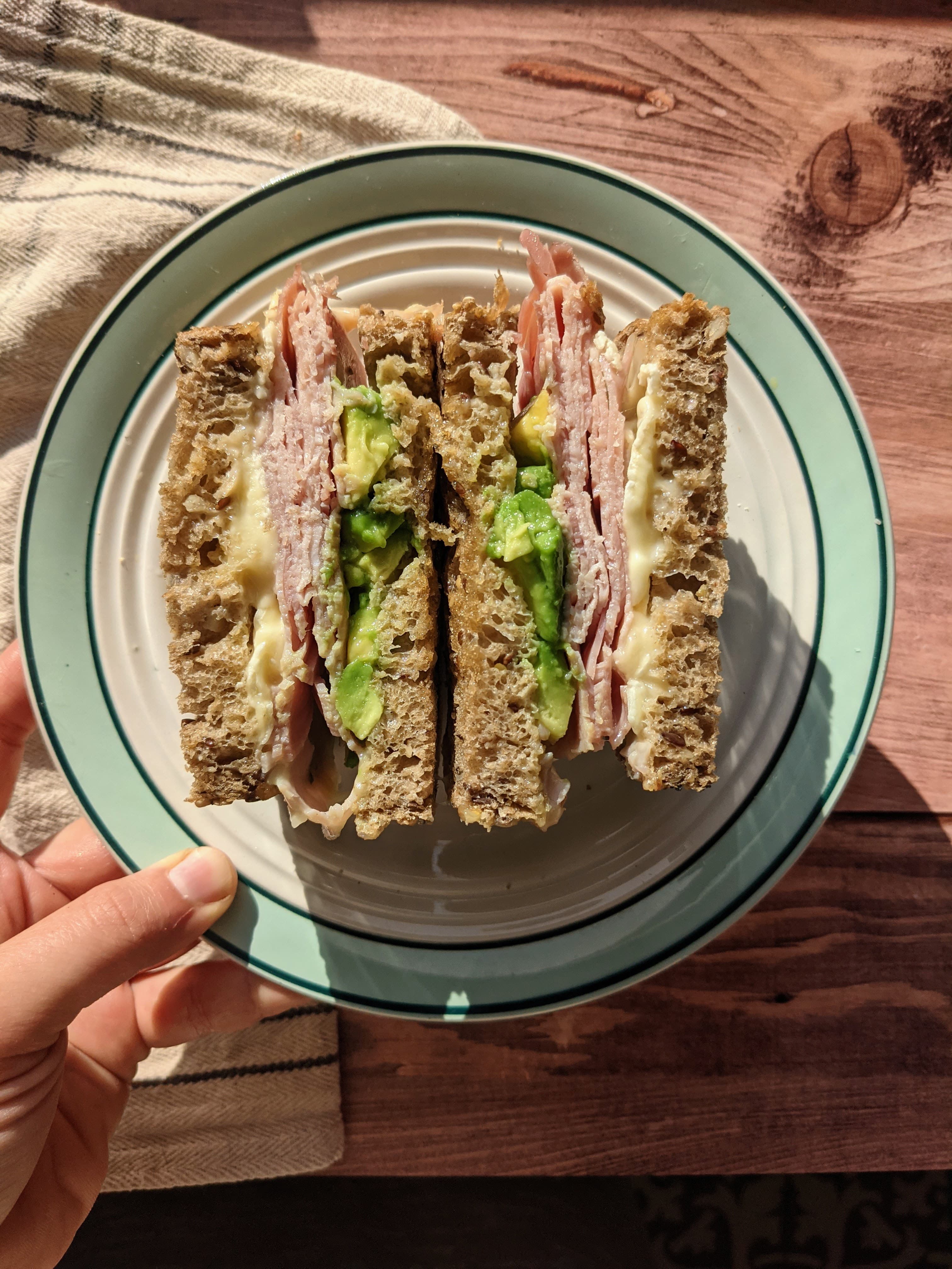 Healthy grilled sandwich with ham, avocado and brie
